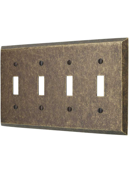 Traditional Forged Brass Quad Toggle Switch Plate in Antique Brass.